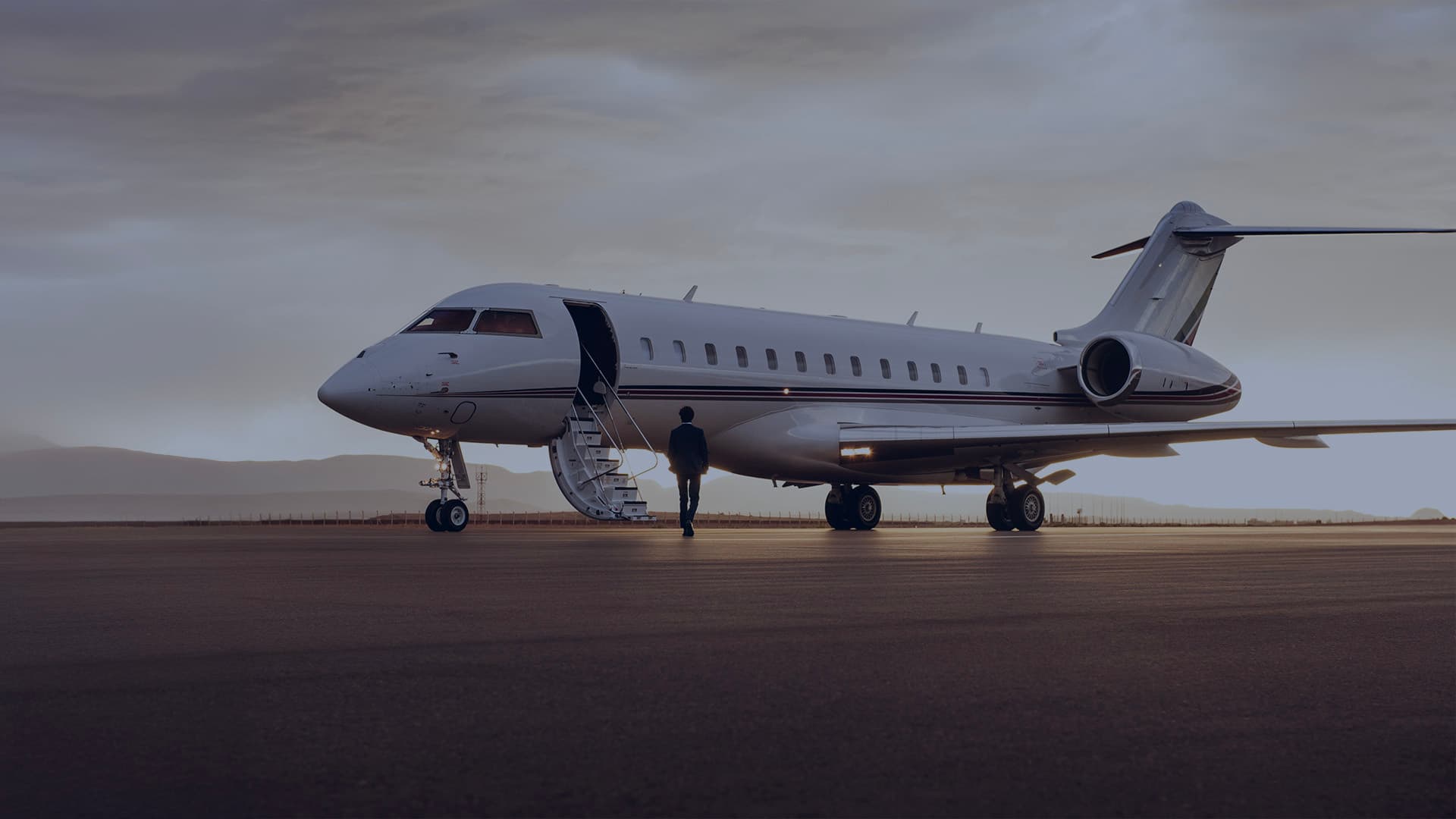 Private jet on the ramp at dusk